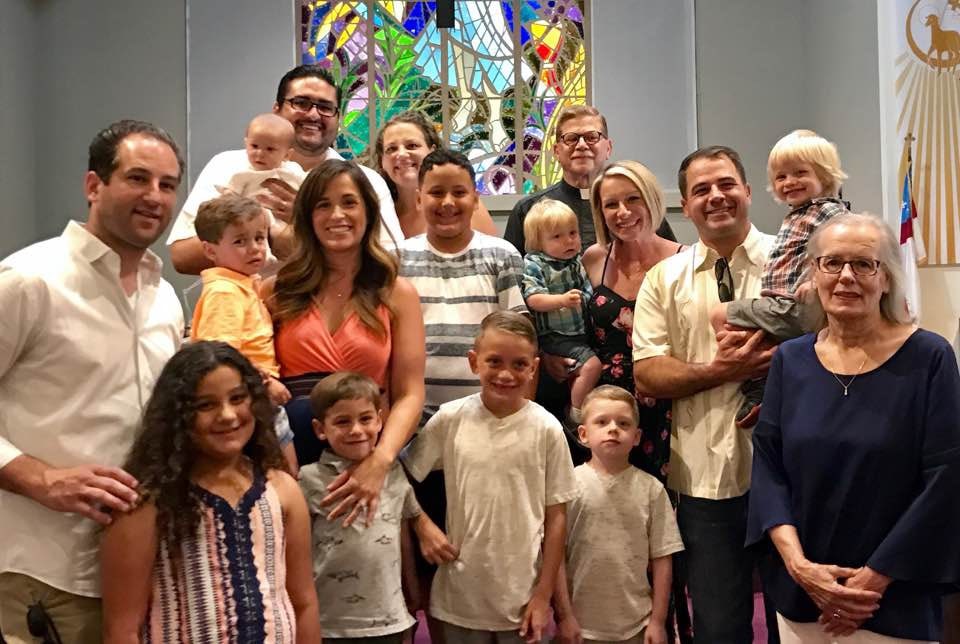 Church family group poses for photo inside Good Samaritan Church, San Jose