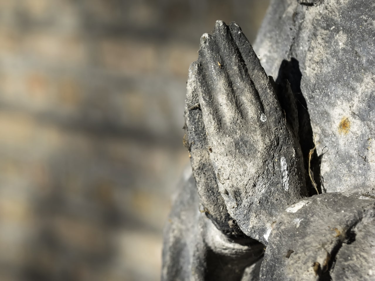 Statue with praying hands